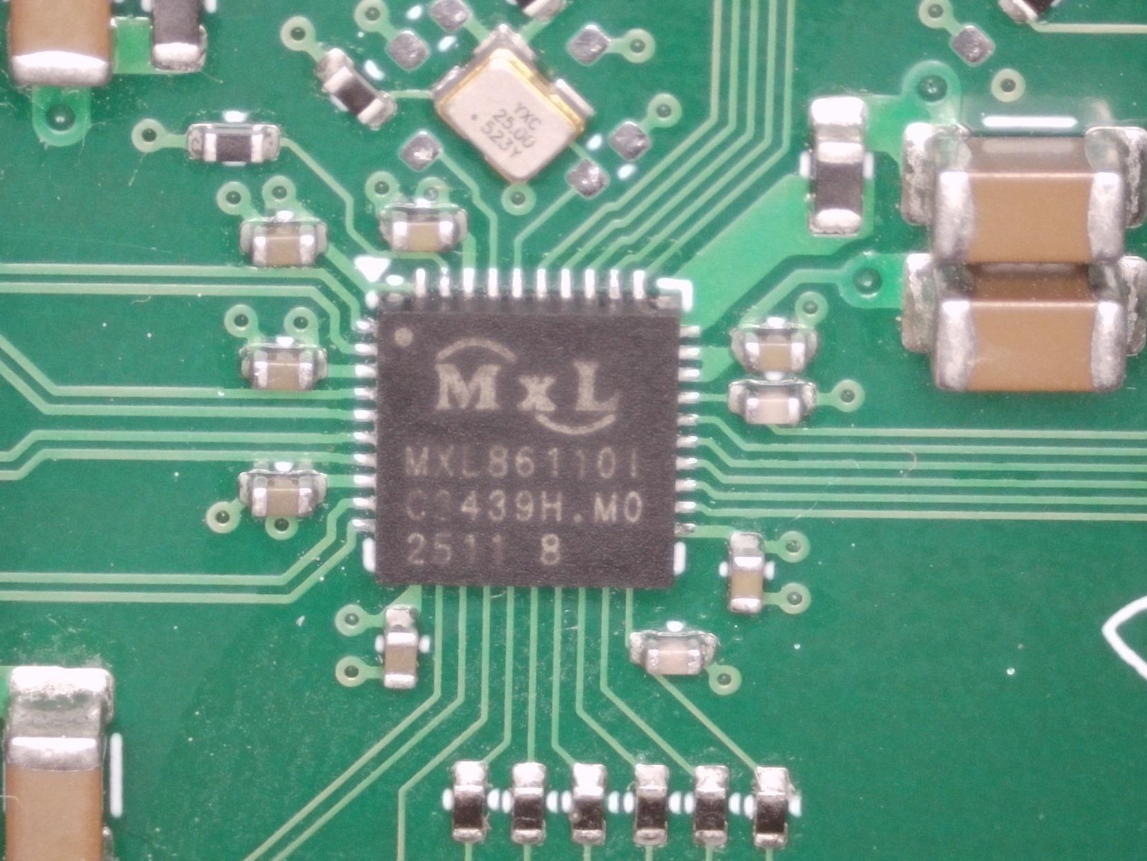 photo of a chip marked "MXL MXL86110I"