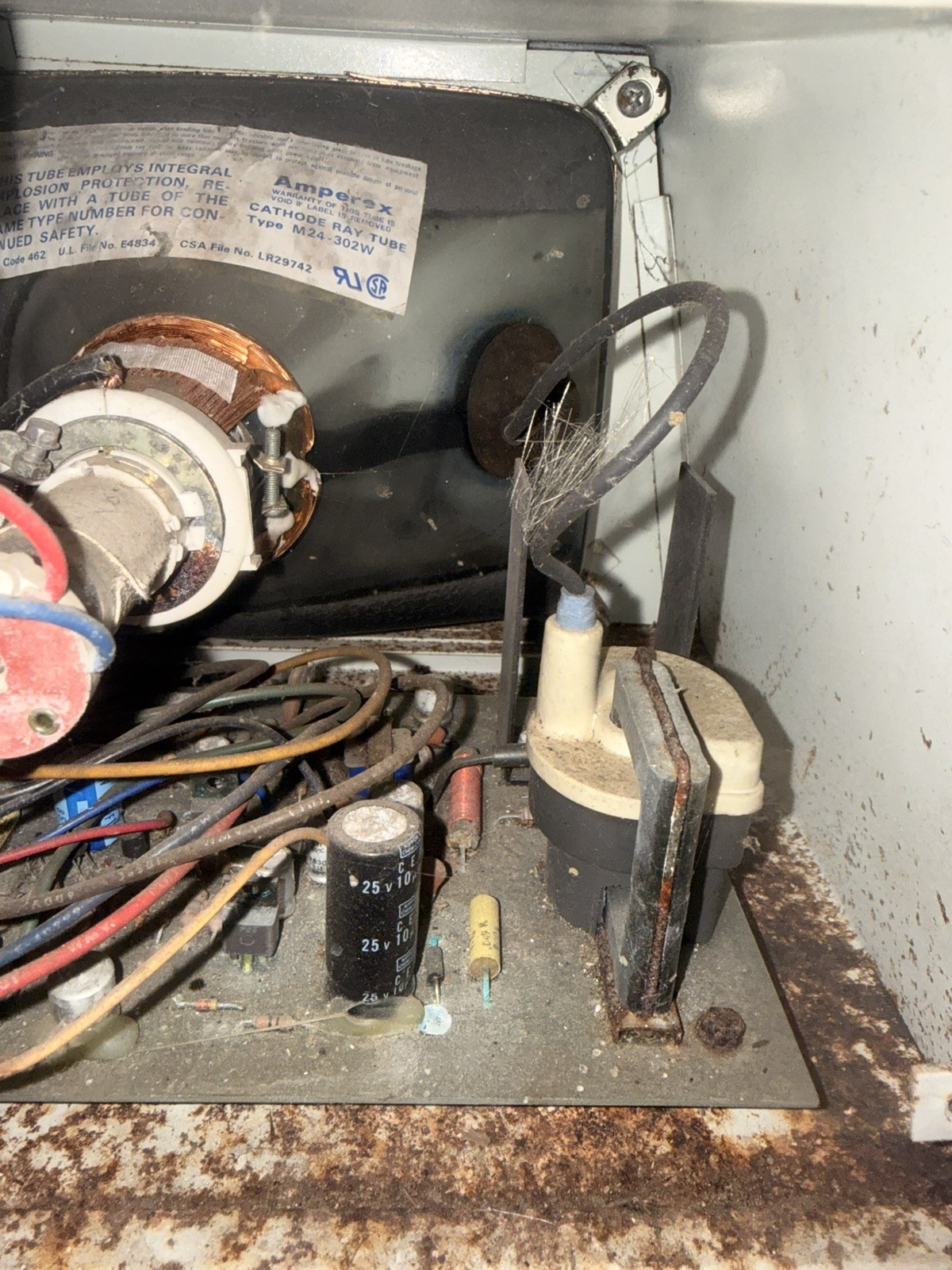 This nightmare was originally a CRT. The cable from the flyback transformer has split and the strands are splayed out, possibly touching the heatsink of the line output transistor. If you plan to turn this on, I recommend doing it from another continent.