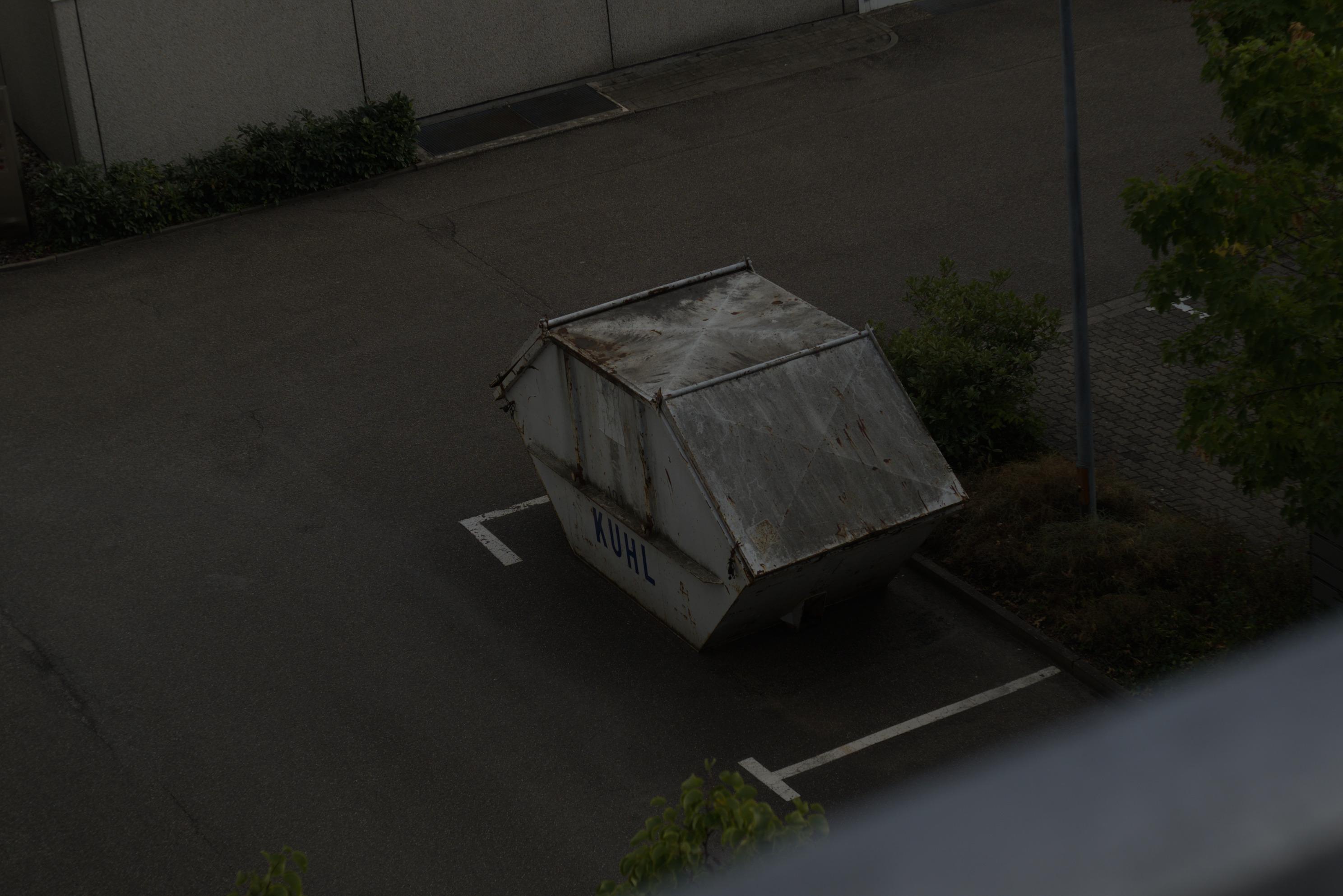 dumpster bin what says Kuhl on it